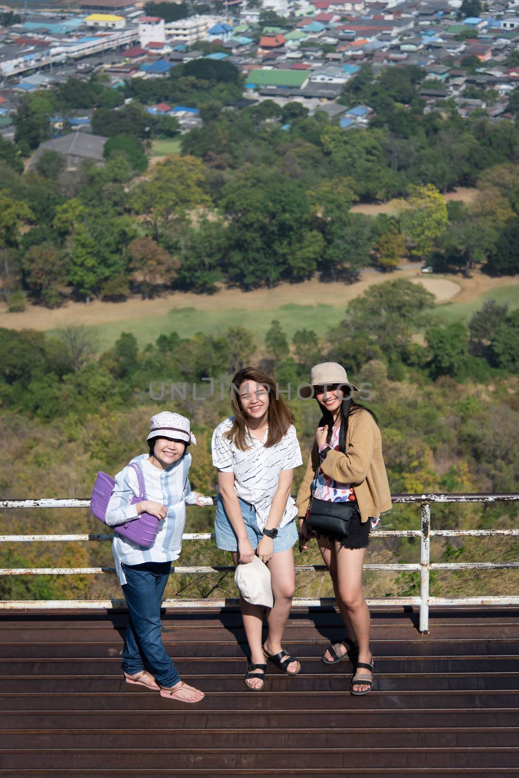 Asian pretty cute women with hat relax at seaside city landscape viewpoint on mountain with happy and freedom emotion in concept travel, vacation, leisure in life