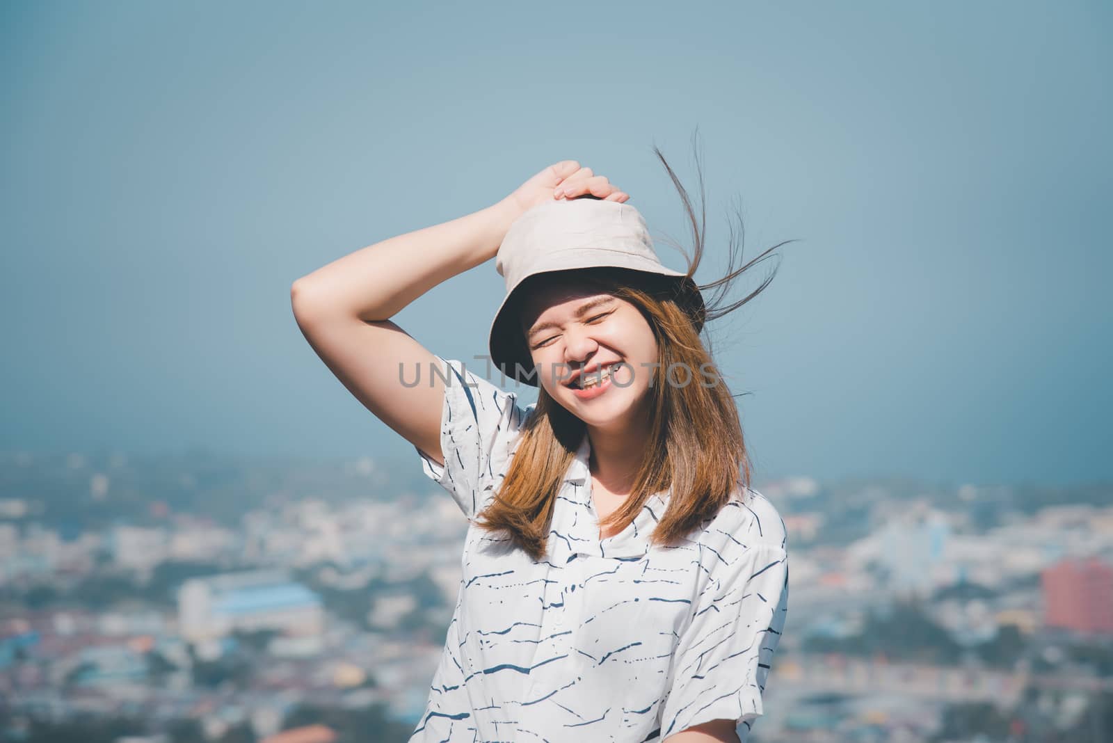 Woman relax at sea viewpoint in concept travel by PongMoji