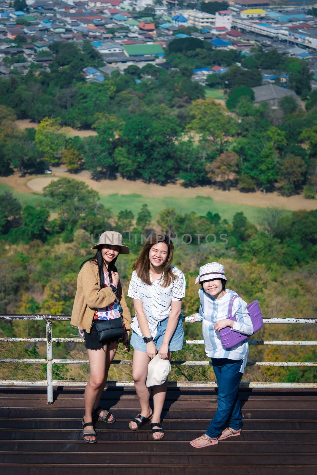 Women relax at landscape viewpoint on mountain by PongMoji