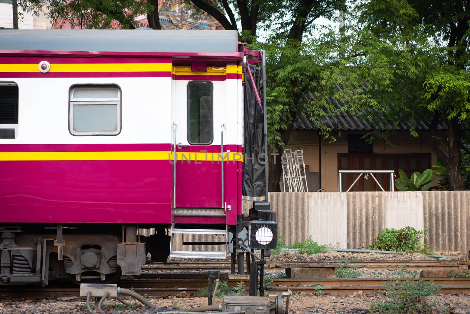 Thai railway train with locomotive runs in Bangkok by PongMoji