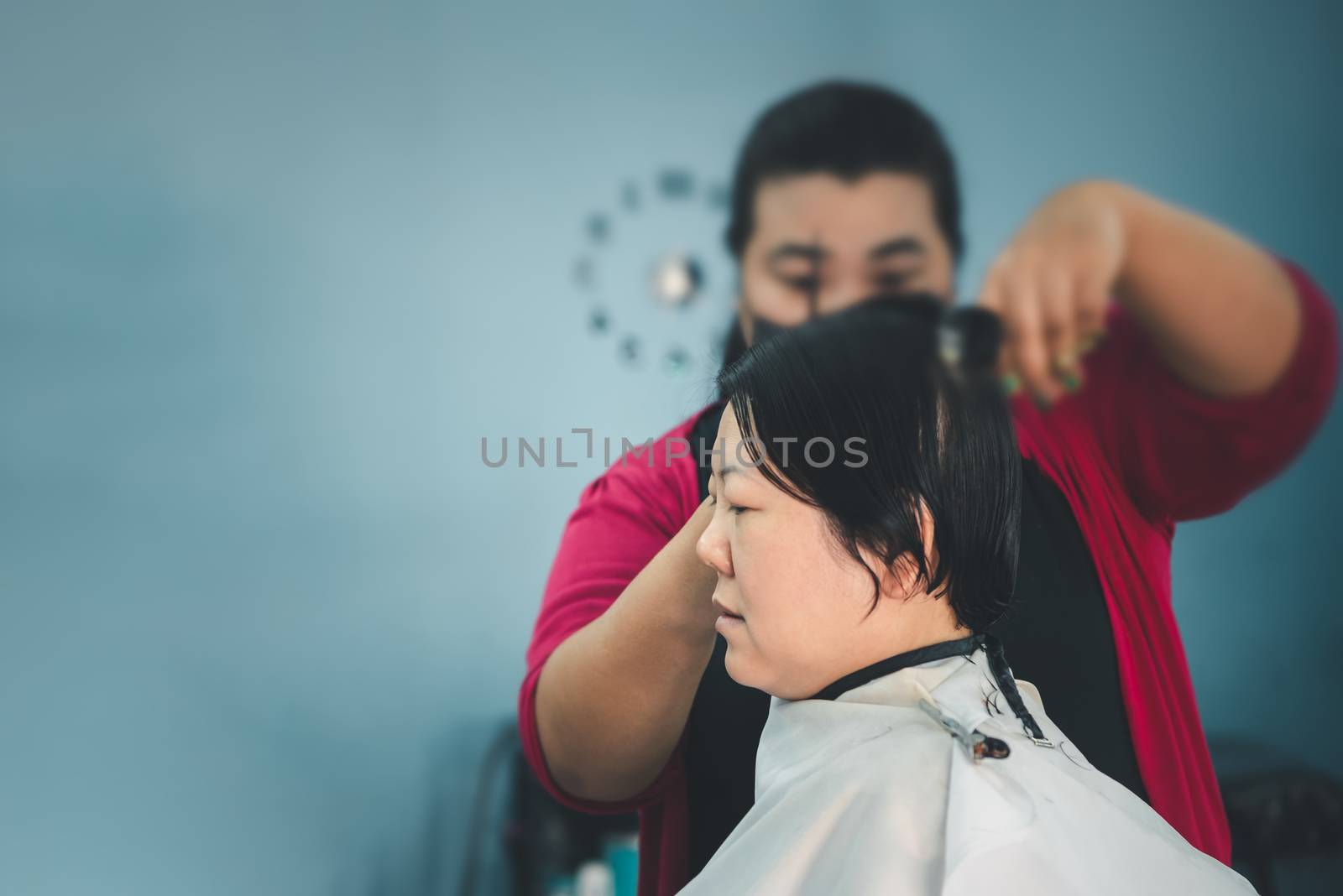 Hairstyle or barber haircut customer at barbershop by PongMoji