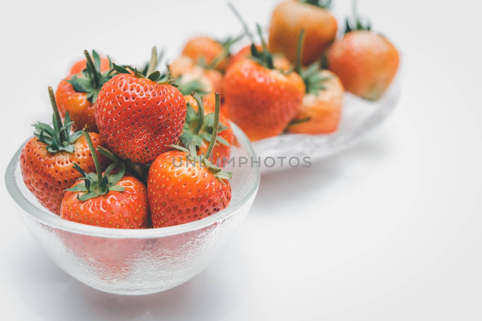 Strawberry is red fresh berry fruit color and sweet juicy for sale at Thai street food and fruit market in concept food and fruit, healthy eating in life