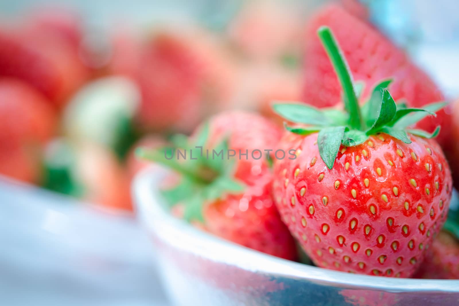 Strawberry is red fresh berry fruit color and sweet juicy for sale at Thai street food and fruit market in concept food and fruit, healthy eating in life