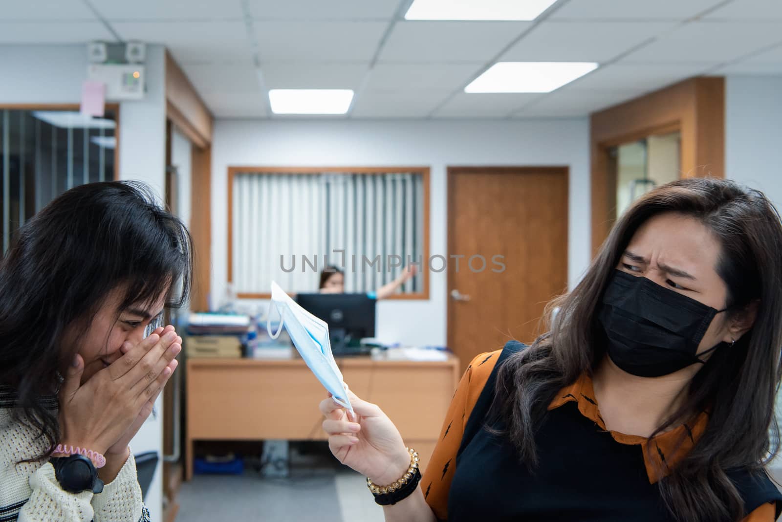 Asian pretty women wearing mask respiratory protection mask against epidemic flu covid19 or corona virus influenza in office with fear emotion in concept illness, outbreak, healthcare in life