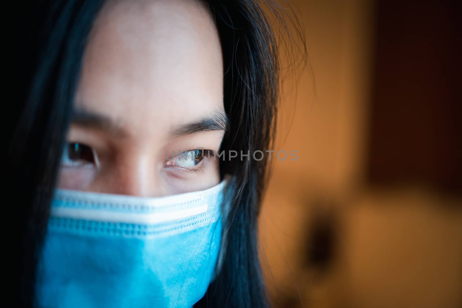 Asian pretty woman wearing mask respiratory protection mask against epidemic flu covid19 or corona virus influenza in office with fear emotion in concept illness, outbreak, healthcare in life