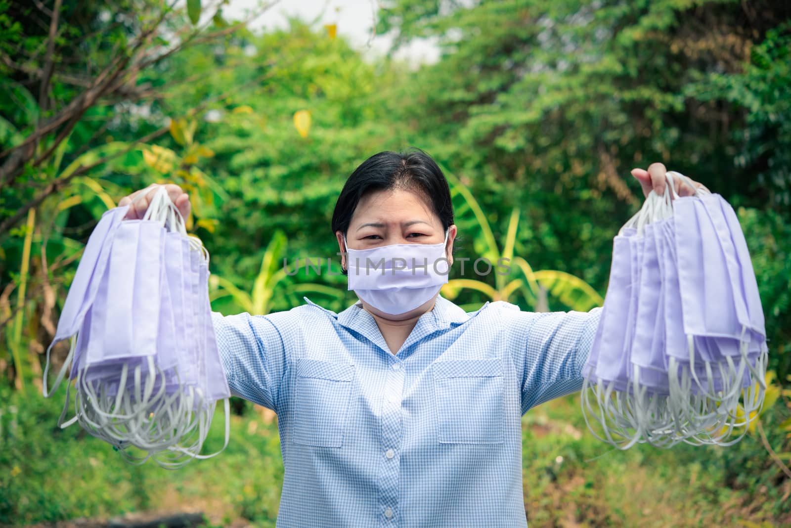 Asian pretty woman wearing mask respiratory protection mask against epidemic flu covid19 or corona virus from wuhan in office with fear emotion in concept illness, outbreak, healthcare in life