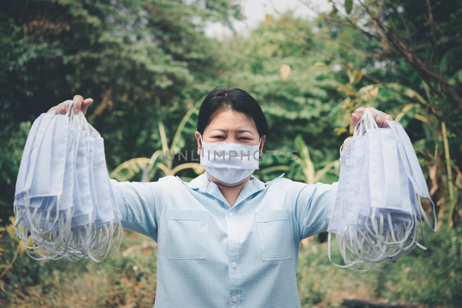 Asian pretty woman wearing mask respiratory protection mask against epidemic flu covid19 or corona virus from wuhan in office with fear emotion in concept illness, outbreak, healthcare in life