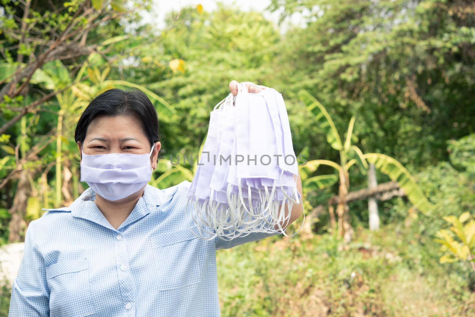 Asian pretty woman wearing mask respiratory protection mask against epidemic flu covid19 or corona virus from wuhan in office with fear emotion in concept illness, outbreak, healthcare in life