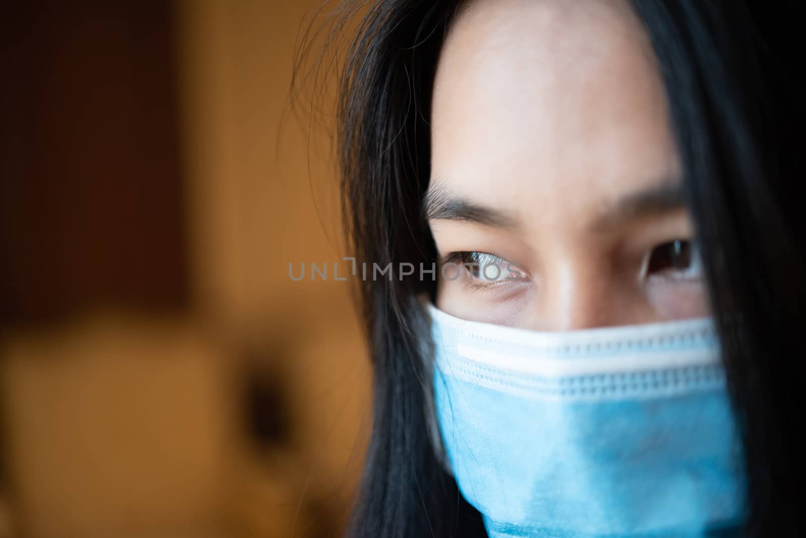 Asian pretty woman wearing mask respiratory protection mask against epidemic flu covid19 or corona virus influenza in office with fear emotion in concept illness, outbreak, healthcare in life