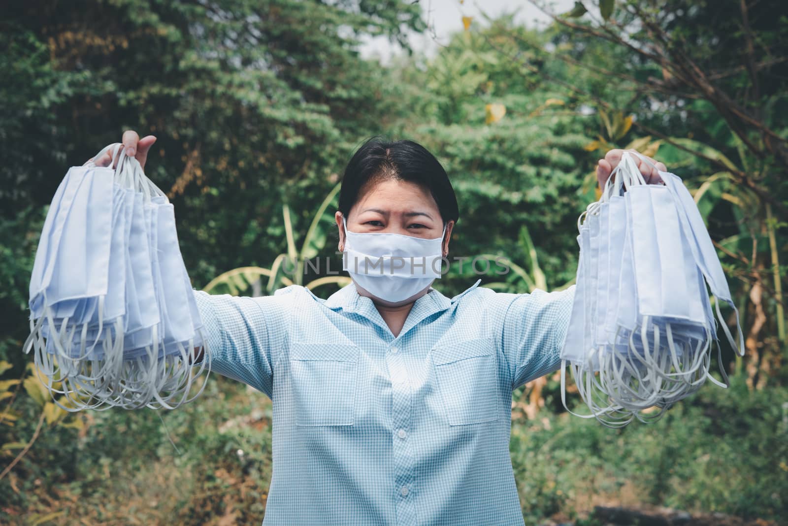 Asian pretty woman wearing mask respiratory protection mask against epidemic flu covid19 or corona virus from wuhan in office with fear emotion in concept illness, outbreak, healthcare in life