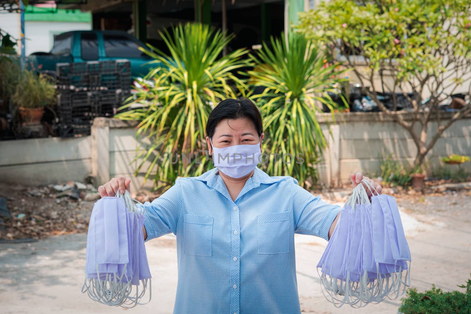 Asian pretty woman wearing mask respiratory protection mask against epidemic flu covid19 or corona virus from wuhan in office with fear emotion in concept illness, outbreak, healthcare in life