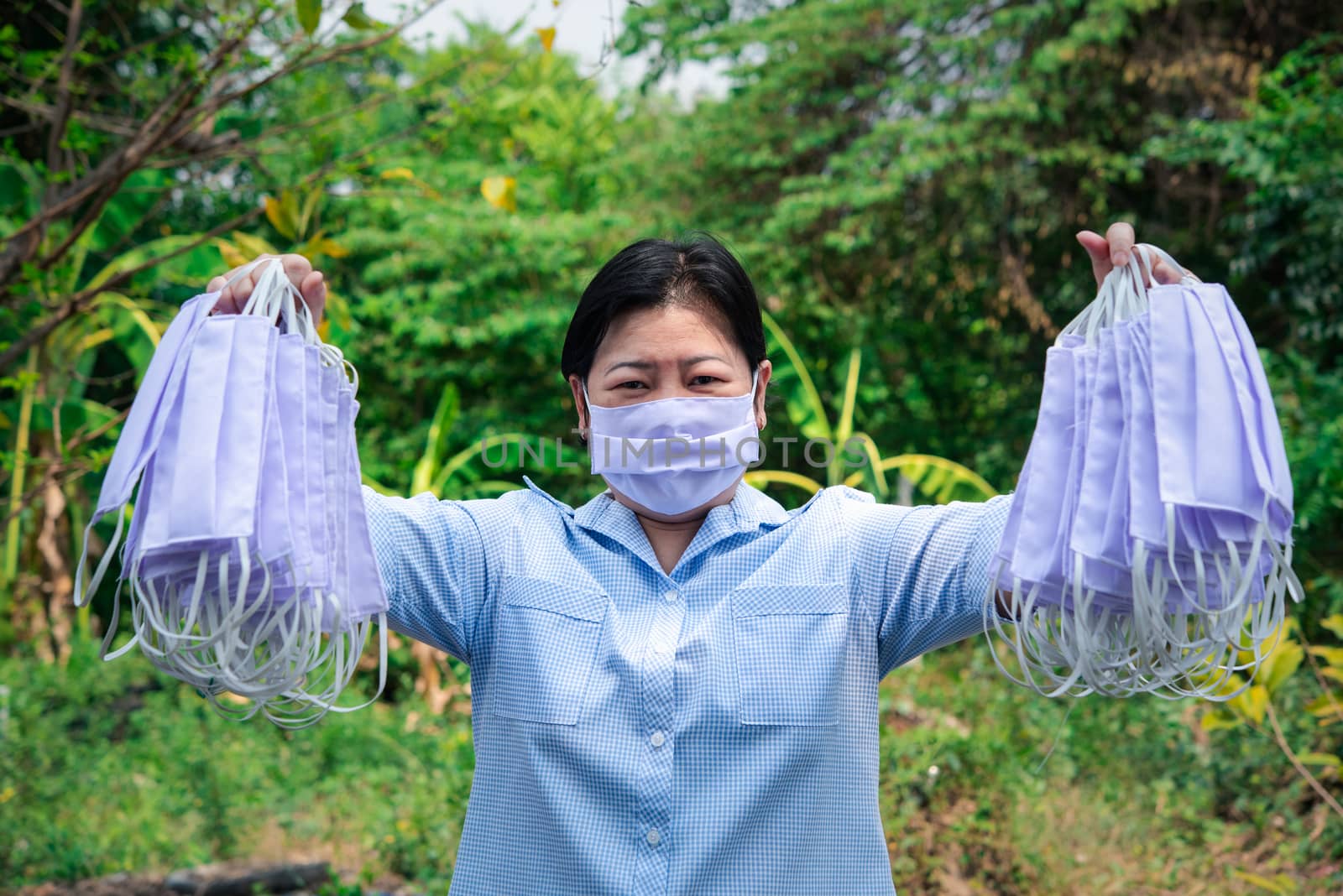 Asian pretty woman wearing mask respiratory protection mask against epidemic flu covid19 or corona virus from wuhan in office with fear emotion in concept illness, outbreak, healthcare in life