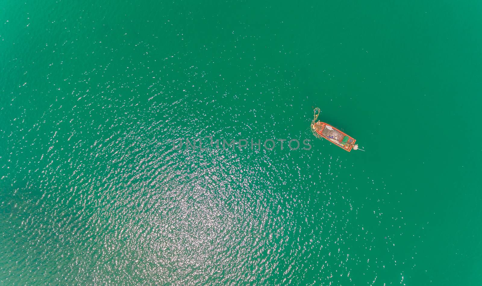 Aerial view of Local fisherman boat in over the sea by wyoosumran