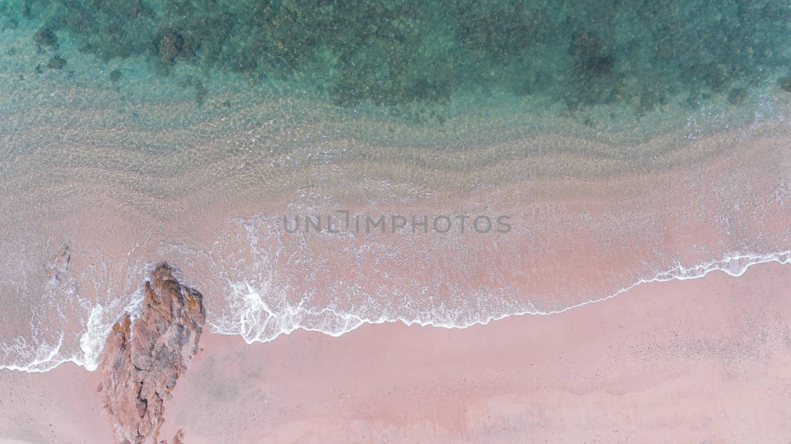 Aerial view of beach with sea wave  by wyoosumran