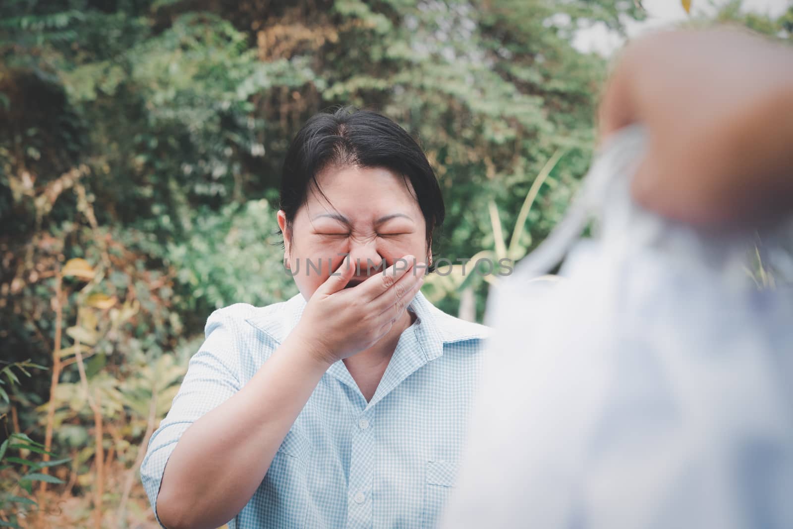 Asian pretty woman wearing mask respiratory protection mask against epidemic flu covid19 or corona virus from wuhan in office with fear emotion in concept illness, outbreak, healthcare in life