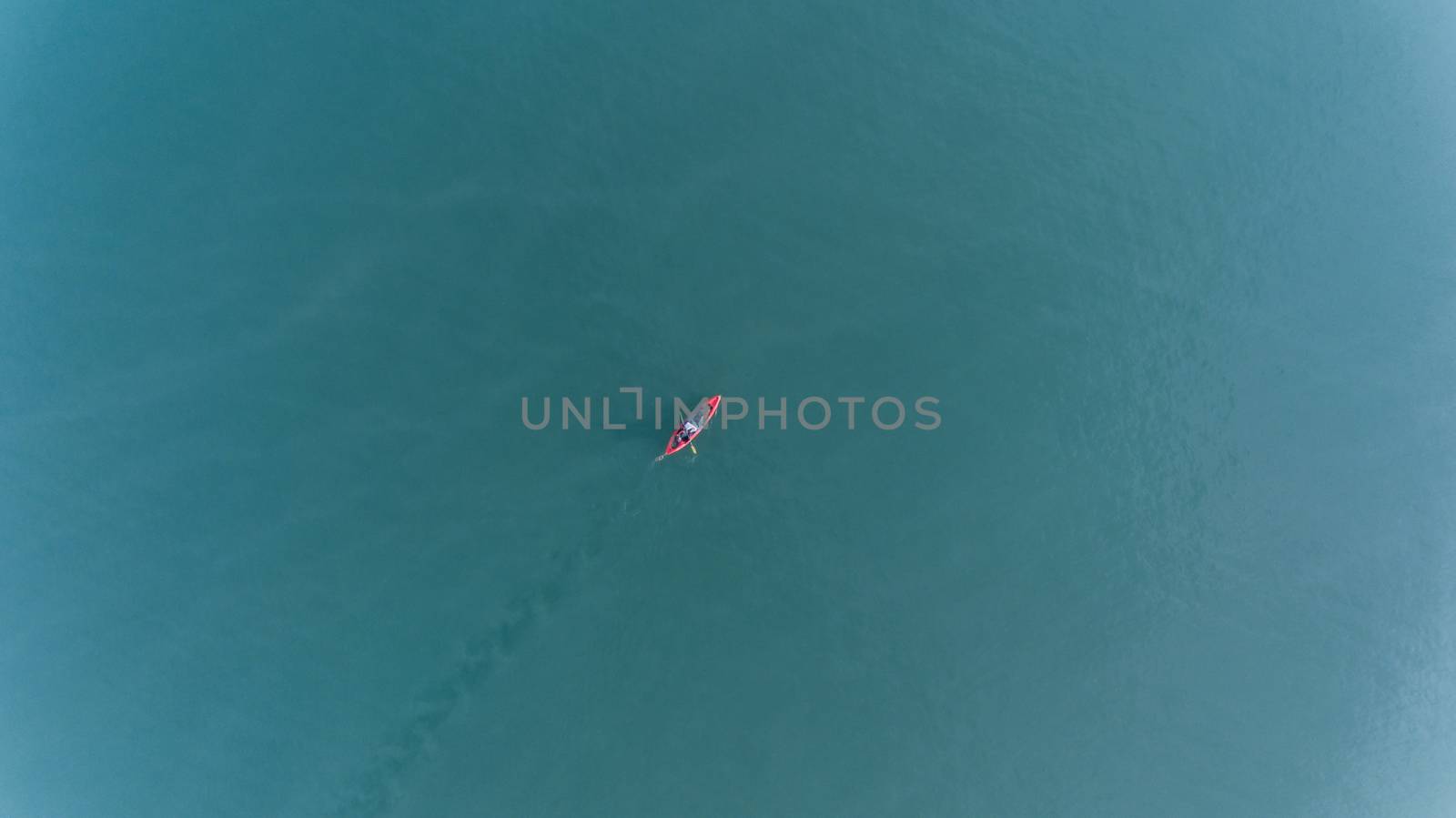 Aerial view of people with kayak over blue sea