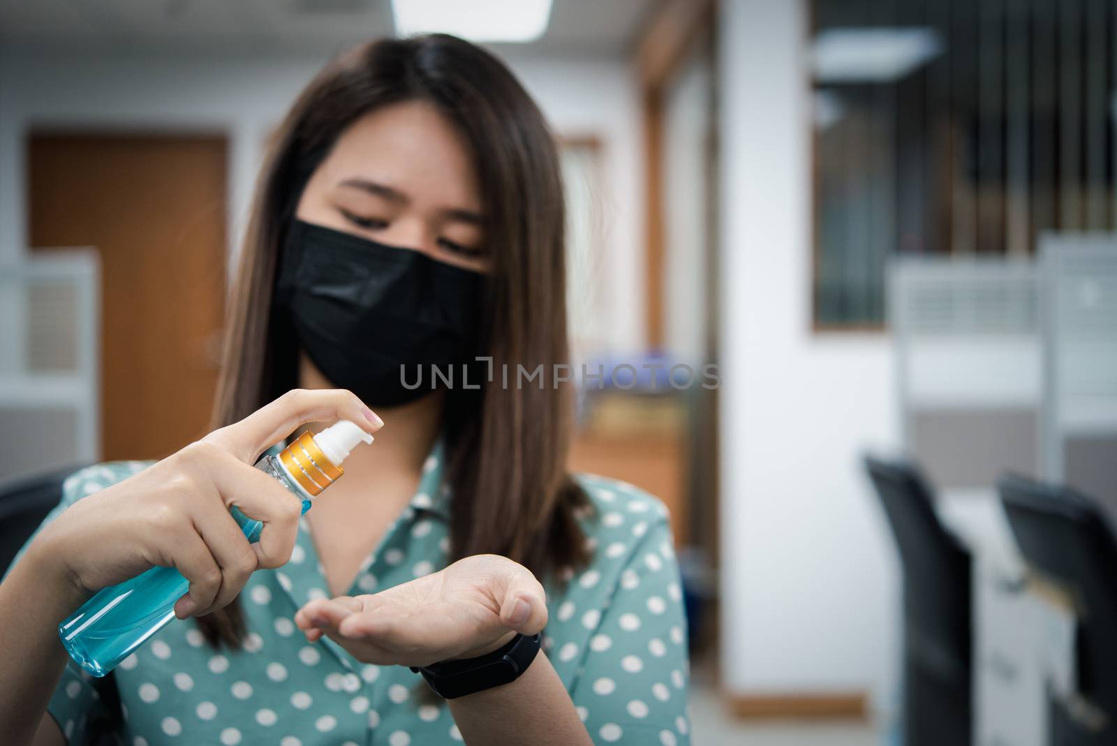 Asian woman wearing mask and alcohol antibacterial hand gel respiratory protection mask against epidemic flu covid19 or corona virus with fear emotion in concept illness, outbreak, healthcare in life