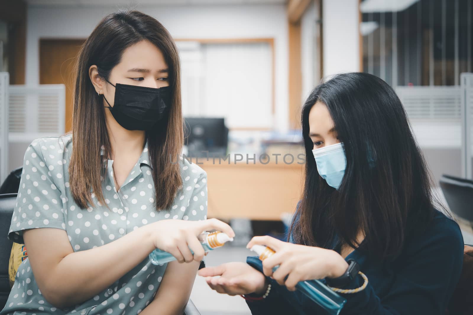 Asian women wearing mask and alcohol antibacterial hand gel respiratory protection mask against epidemic flu covid19 or corona virus with fear emotion in concept illness, outbreak, healthcare in life