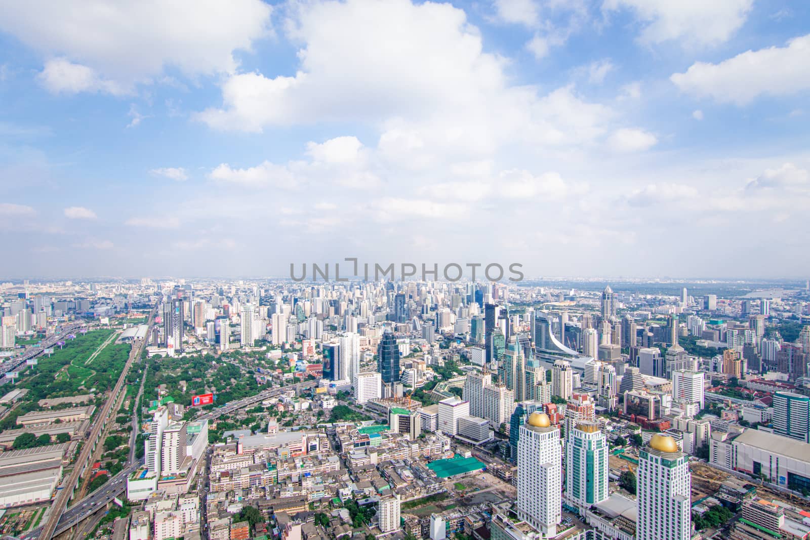 Cityscape and transportation with expressway and traffic in daytime from skyscraper of Bangkok. Bangkok is the capital and the most populous city of Thailand.