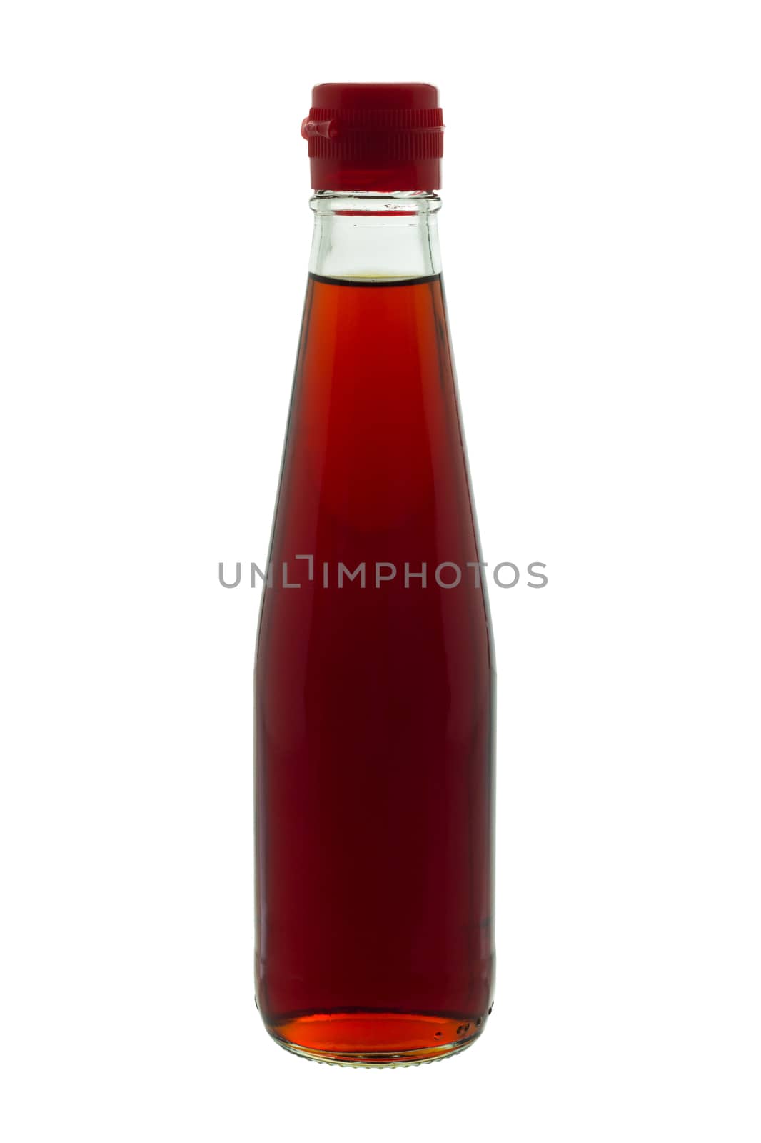 Fish sauce in glass bottle with red lid, isolated on white background