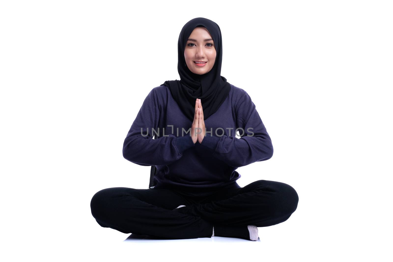 Fitness Muslim Asian girl doing stretch exercise, on white background.