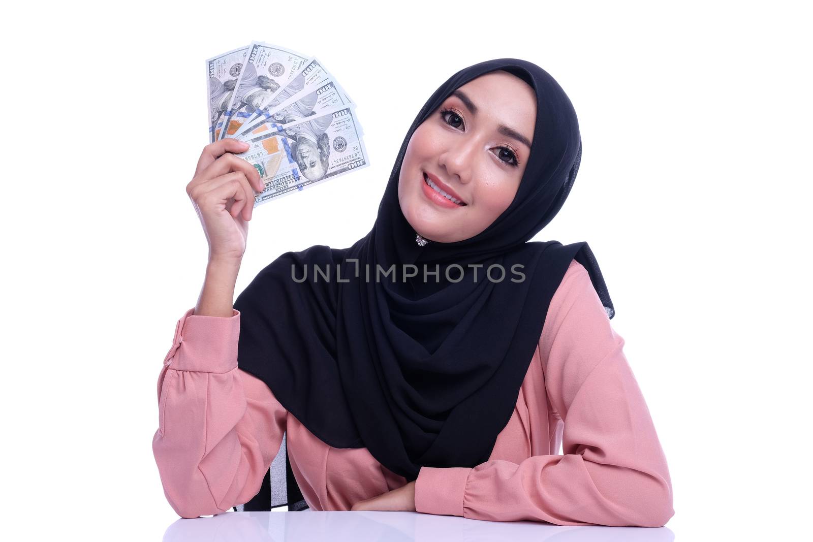 Expression face of pretty muslim woman with money. Finance conceptual or business growth.