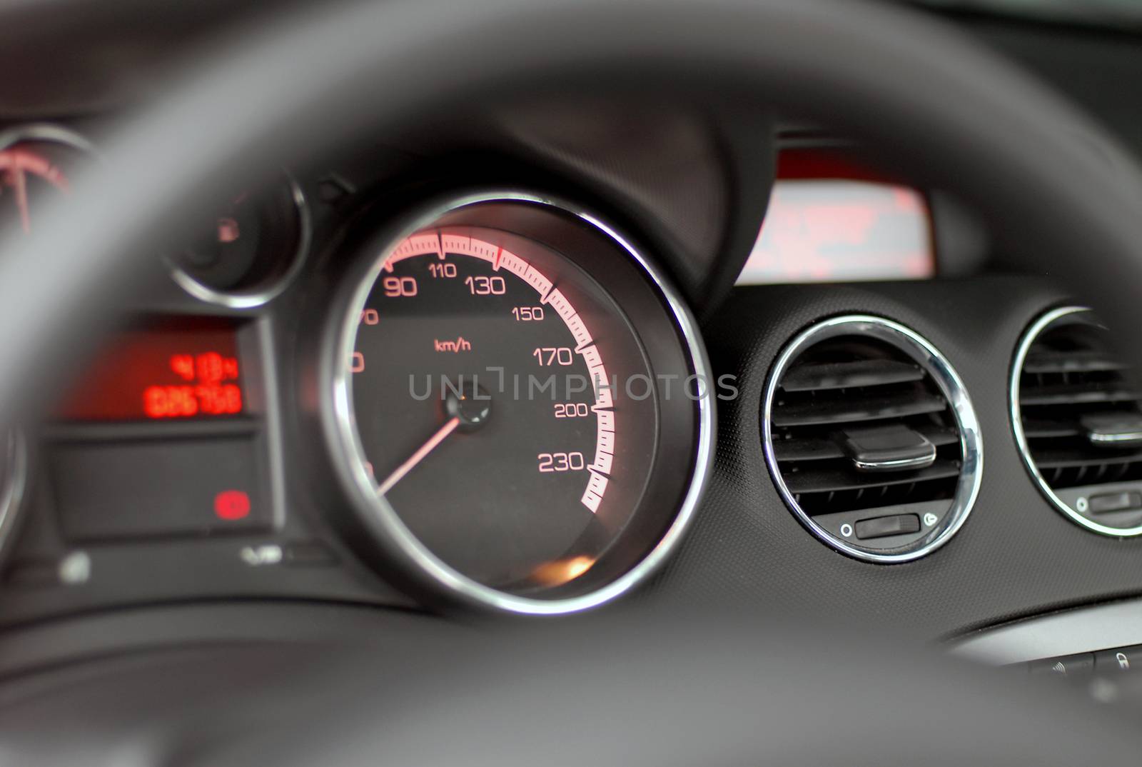 speedometer on dashboard of a modern passenger car
