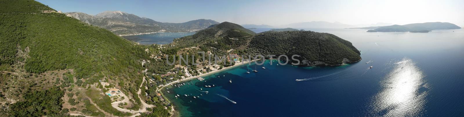 Desimi Beach Golf and nearby Island with clear water in Greece in summer.
