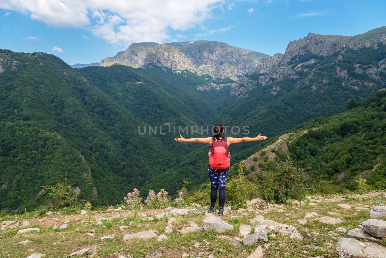 Lone active woman at the edge of the cliff, Central balkan, Bulgaria.