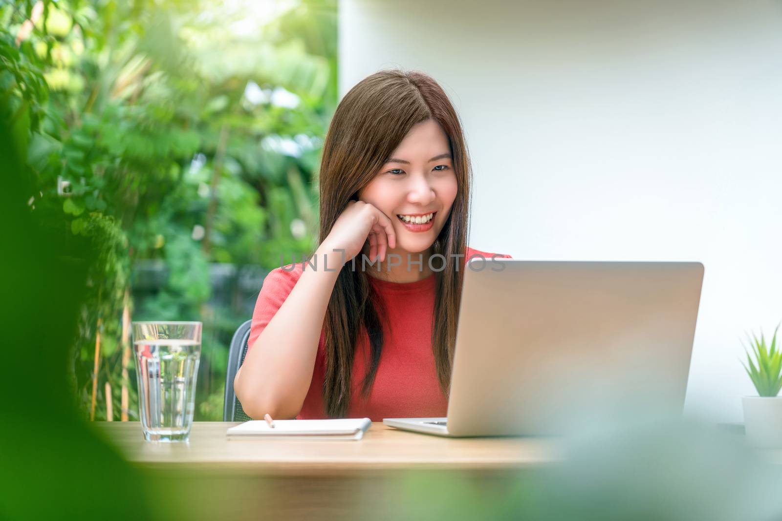 Asian business woman using technology laptop for working from ho by Tzido