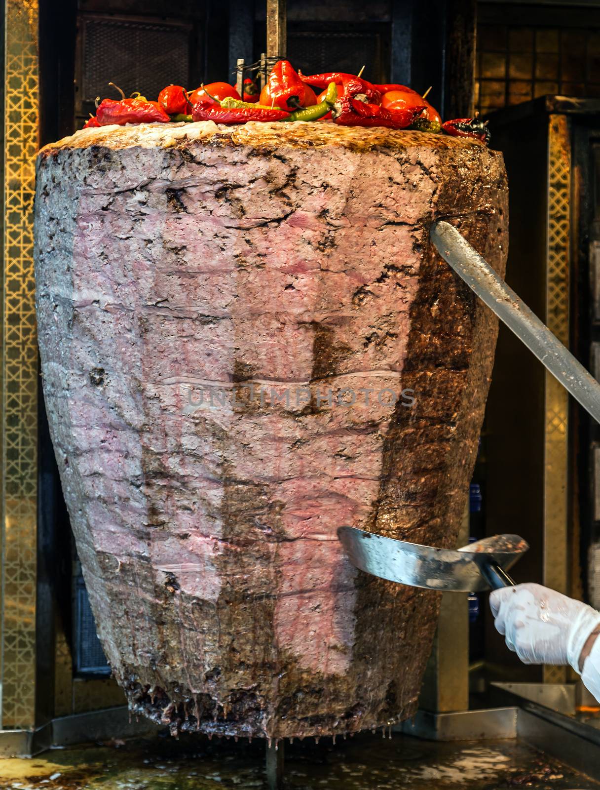 Slicing doner kebab Grilled skewered meat served shawarma by Vladyslav