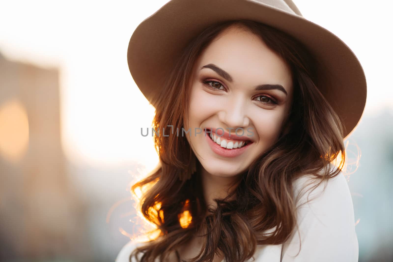 Beautiful brunette emotionally posing at street. by StudioLucky