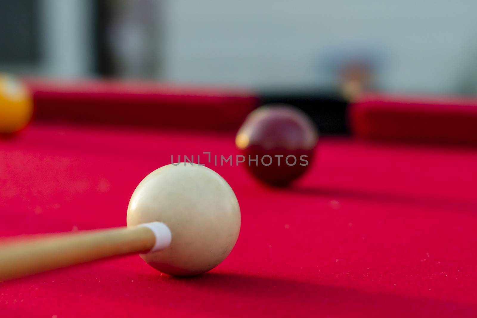 Billiard balls are photographed on fire while sitting outdoors in an open environment