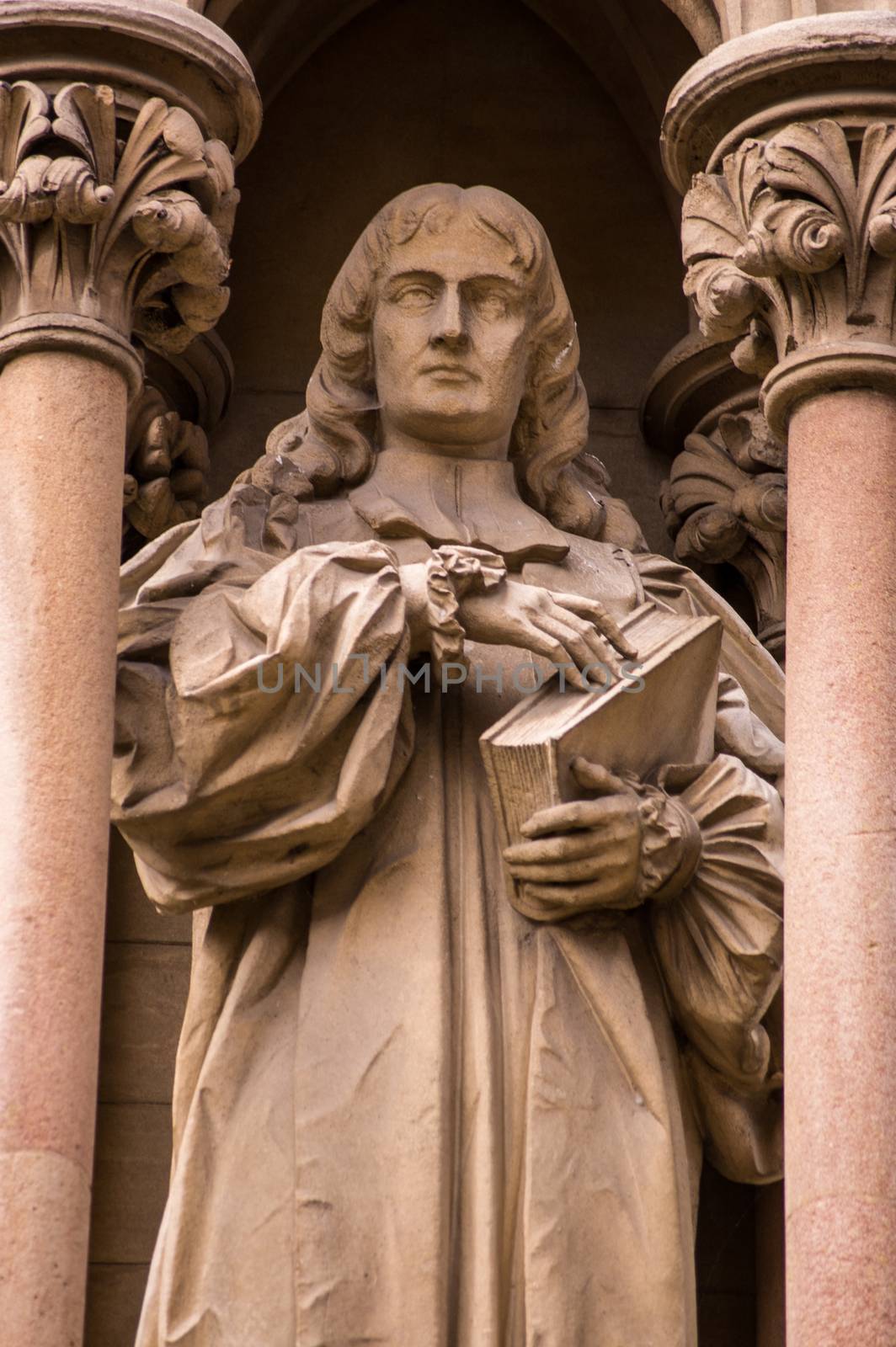 Statue of the former Bishop of Worcester Edward Stillingfleet (1635 - 1699). Outside the chapel of St John's College, Cambridge.