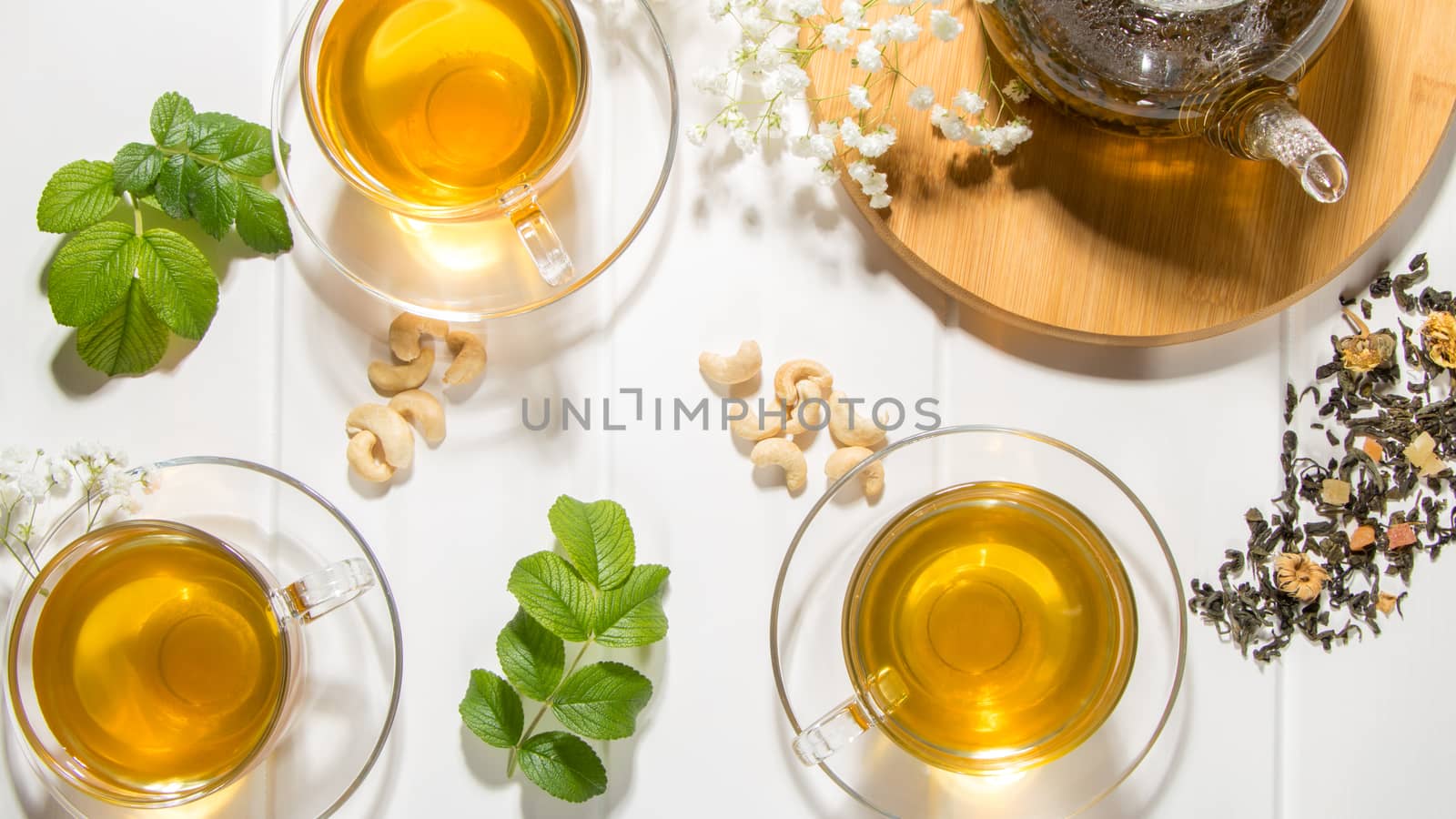 Flower tea with fruit slices. A Cup of green tea and a teapot. Tea ceremony, traditional drink. Afternoon tea, homelike. Flat lay. Oriental, cozy, preparation, heat, tradition, japanese, leafy, herbal