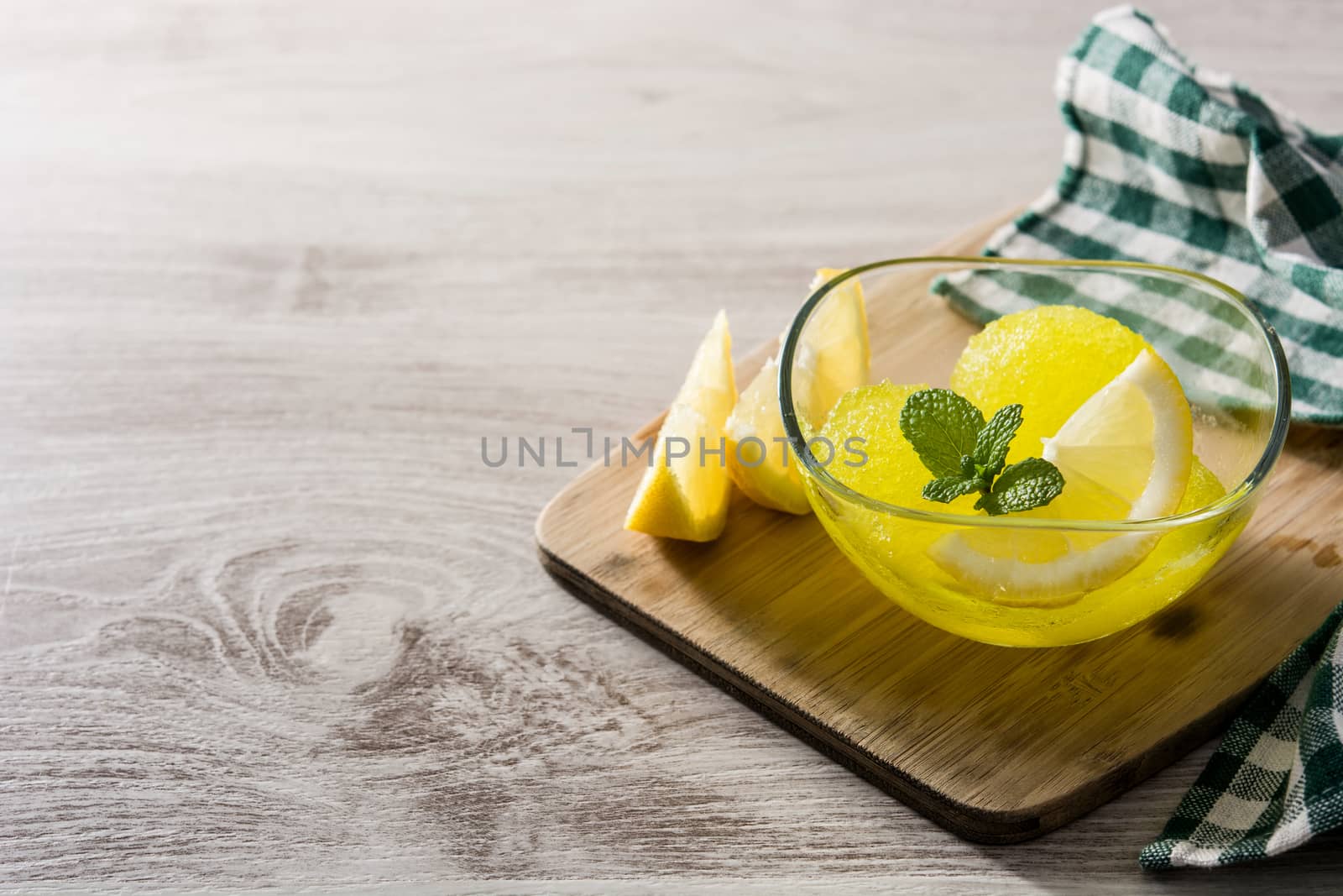 Lemon sorbet in glasses on wooden table