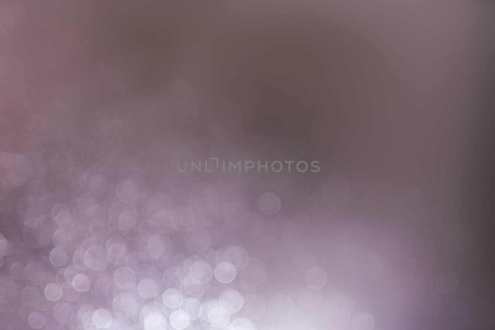 Abstract bokeh from light and water spray in backgrounds of various colors