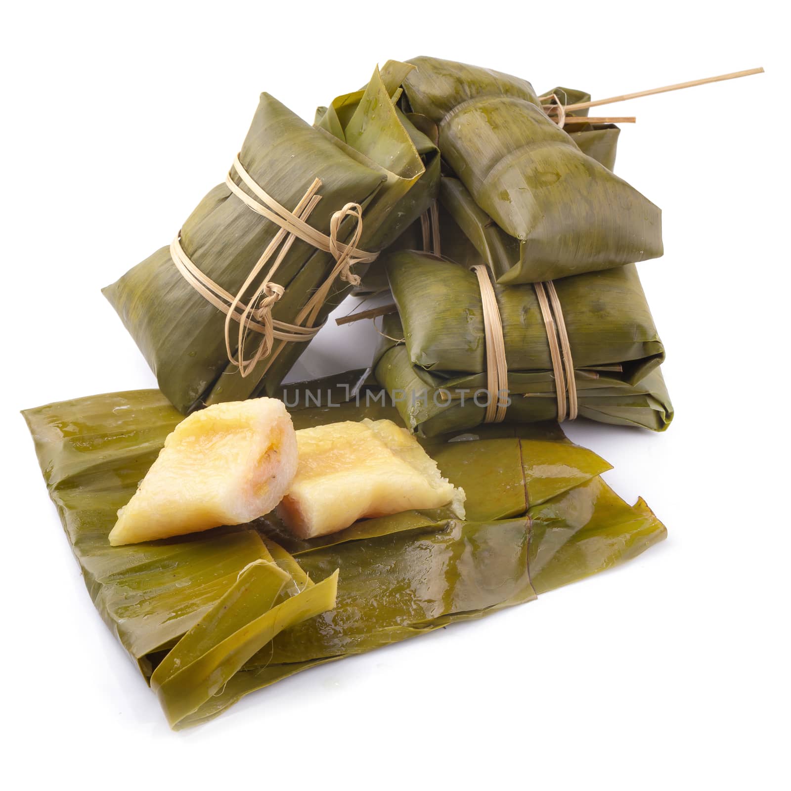 Thai dessert style which insert banana and black Peas inside to sticky rice isolated on white background.