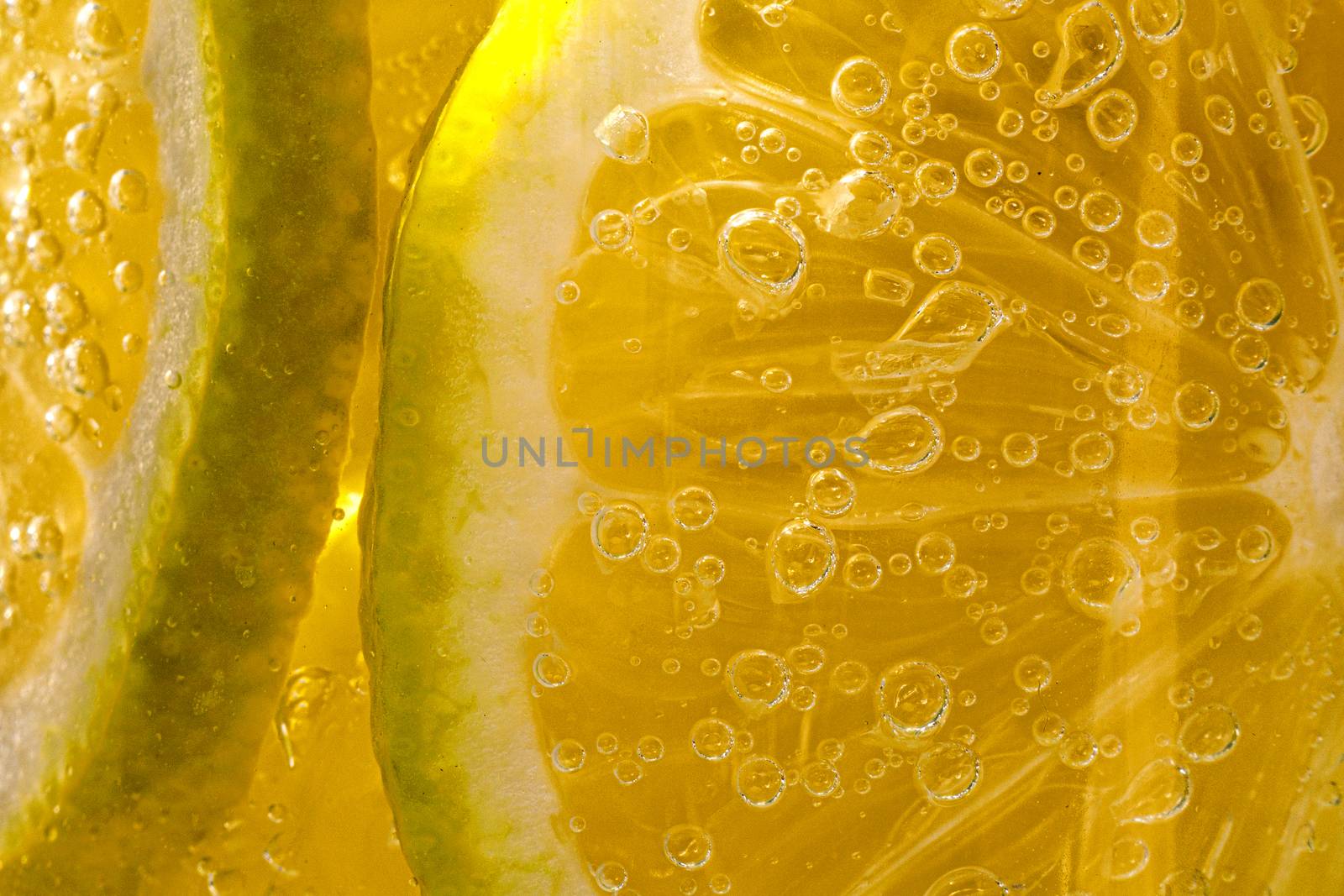 Lemon background. Close up view of lemon slices. Citrus texture. by 9parusnikov