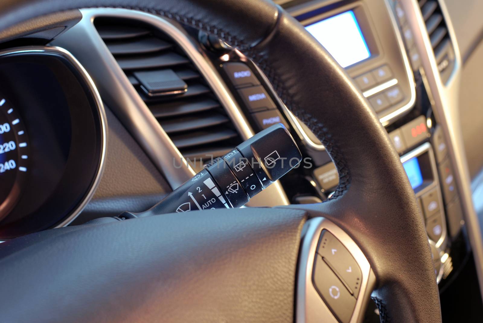 A detail of a modern car's interior - the switch for adjusting the windshield wipers