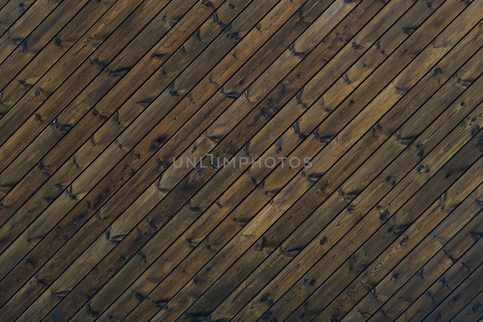 Wood Texture Background dark brown color 45 degree. texture of old wooden planks at an oblique angle. Diagonal background brown old wood planks