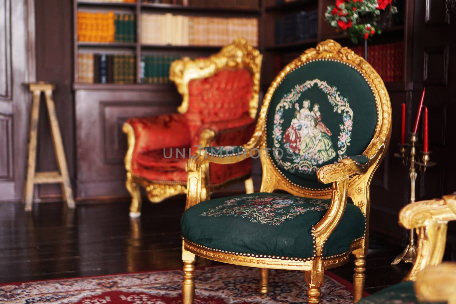 Vintage armchair in the classical library - retro style