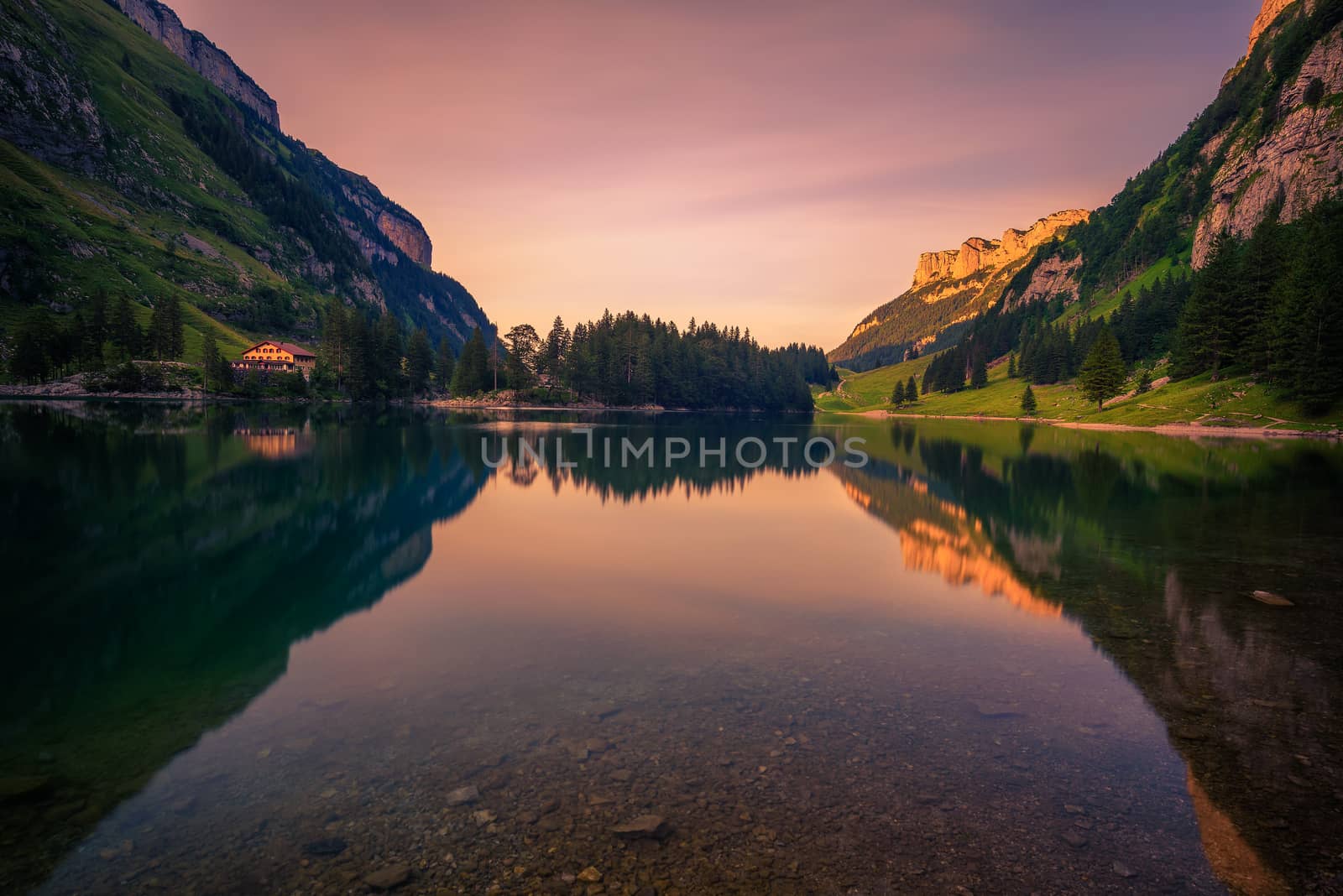 Sunset over the Seealpsee lake in the Appenzell region of Swiss Alps, Switzerland. Long exposure.