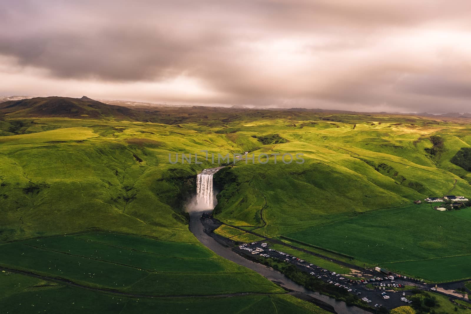 Aerial view of the Skogafoss waterfall in southern Iceland at sunset by nickfox