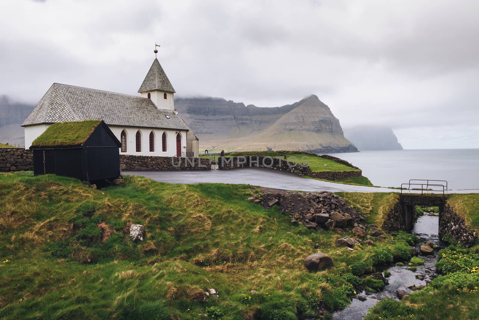 Small church in the village of Vidareidi situated on the sea shore. Vidareidi is the northernmost settlement in the Faroe Islands and lies on the Island of Vidoy.