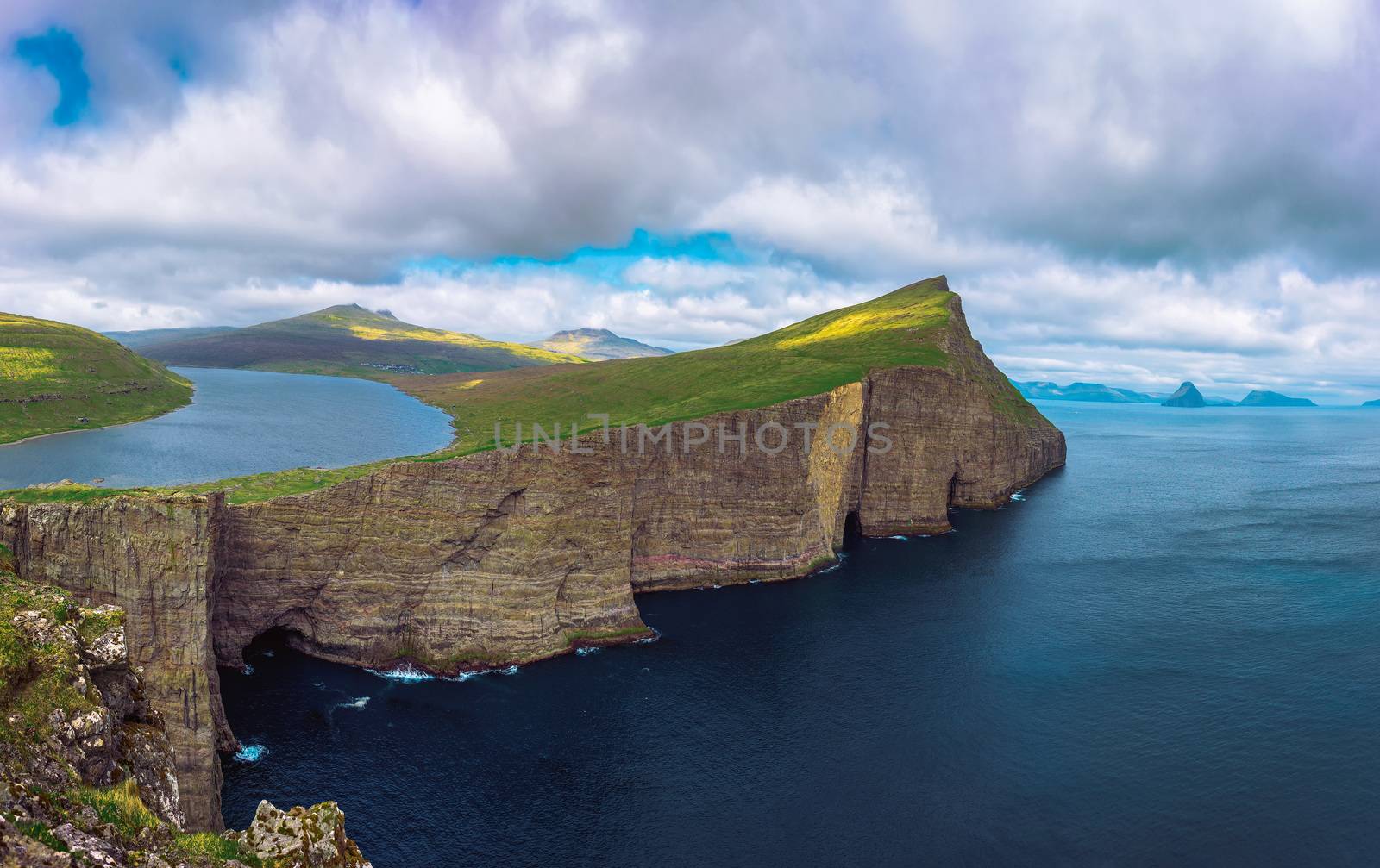 Panorama of the cliff Traelanipan and lake Sorvagsvatn located on the island of Vagar. Leitisvatn or Sorvagsvatn is the largest lake in the Faroe Islands, Denmark.