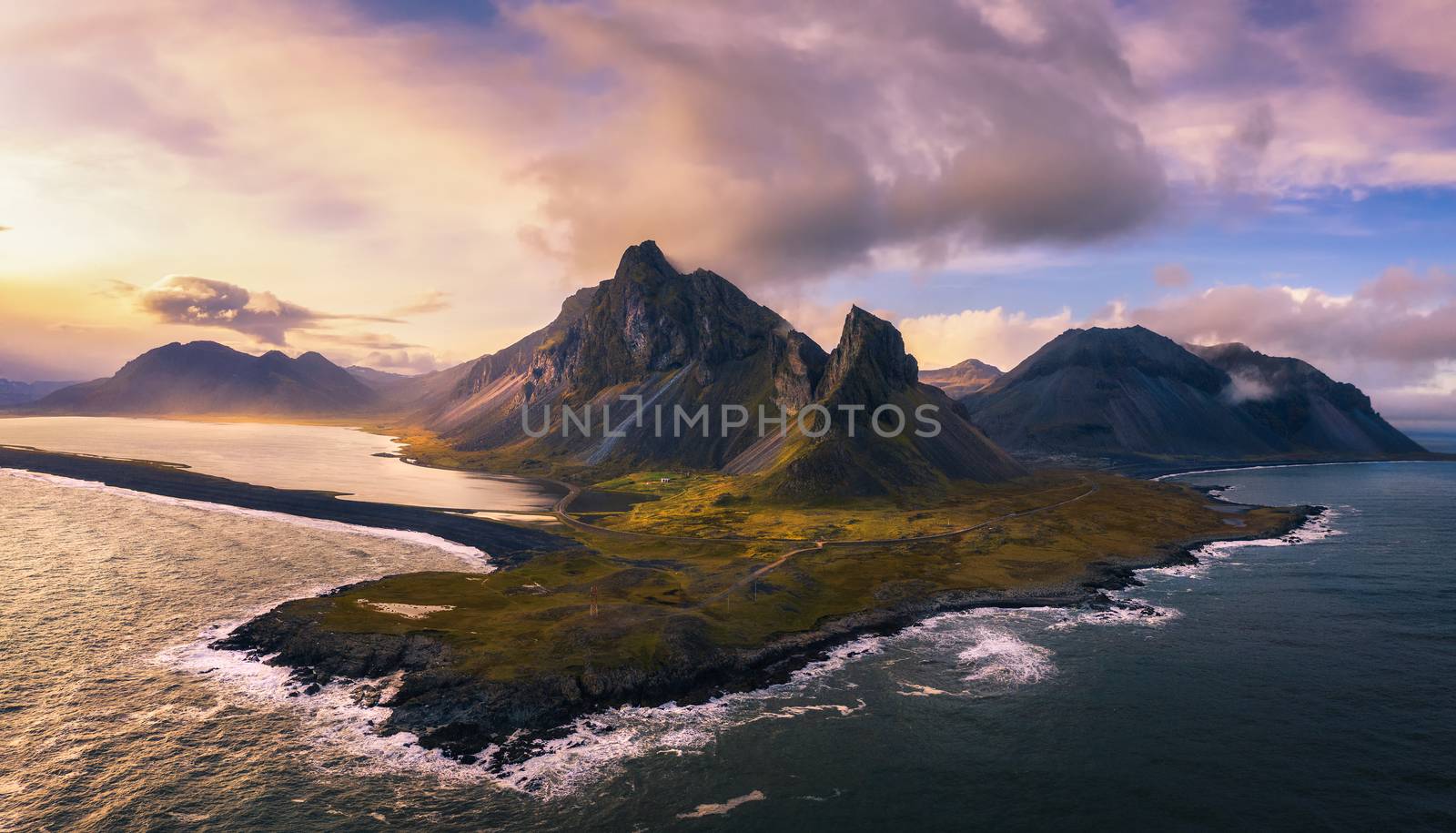 Aerial View of the Eystrahorn with Krossanesfjall Mountain in Iceland at sunset by nickfox