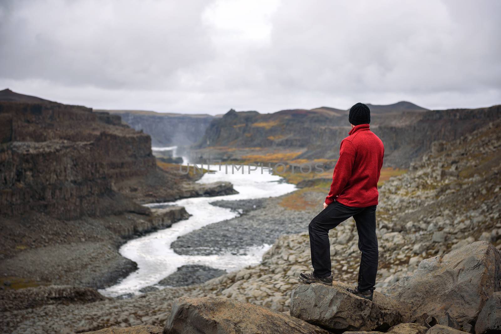 Hiker standing at the edge of a Valley in Vatnajokull National Park in Iceland by nickfox