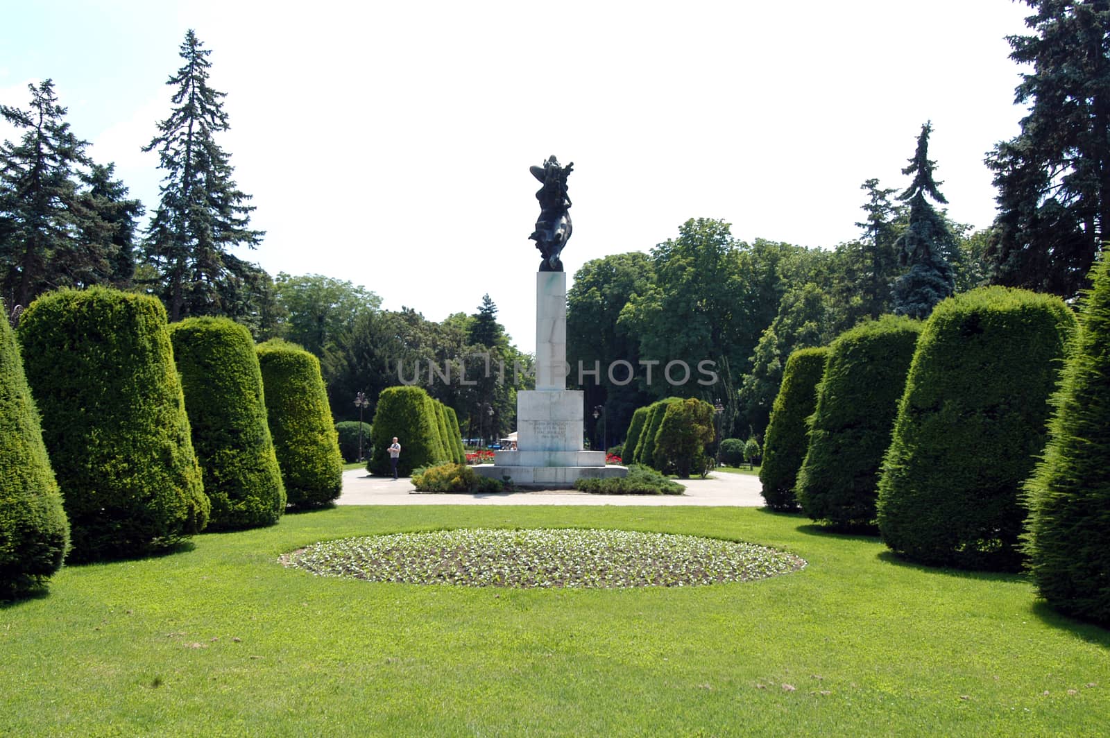 neat park with a stone statue of the middle