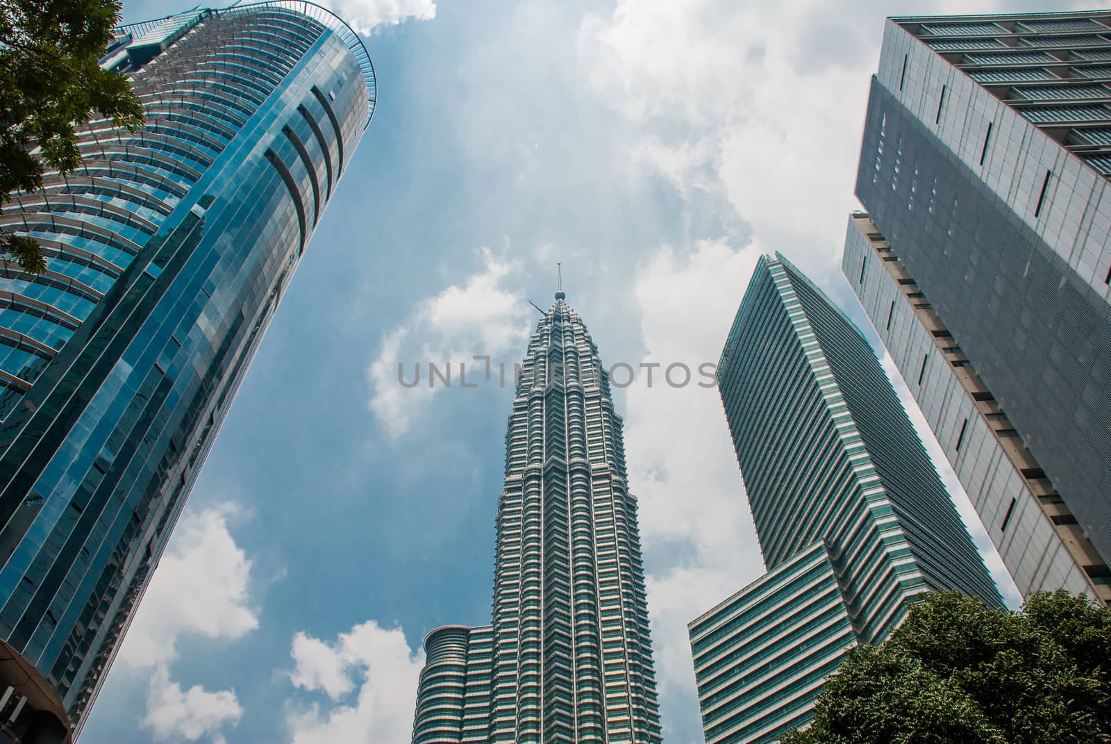KUALA LUMPUR, MALAYSIA - MARCH 2016: The twin towers Petromena the background of blue sky. by Artamonova